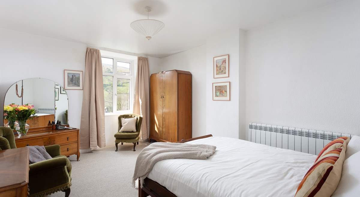 This spacious bedroom could be yours for your stay.