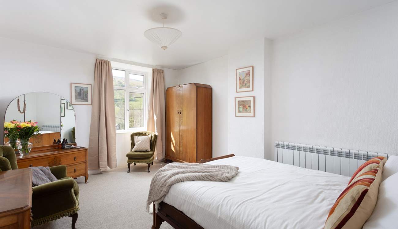 This spacious bedroom could be yours for your stay.