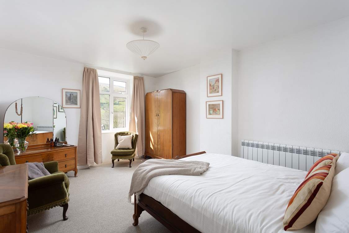 This spacious bedroom could be yours for your stay.