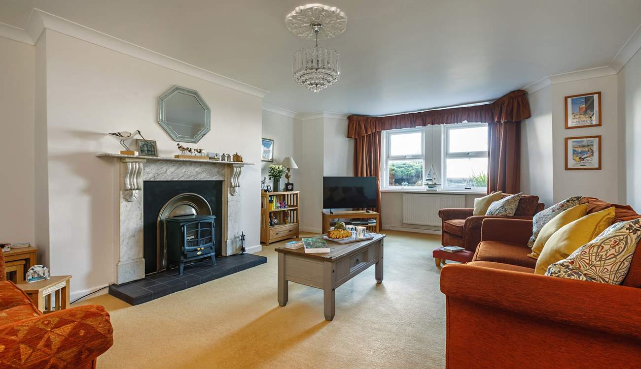 Victorian elegance and high ceilings make this a perfect place to kick off your shoes and relax. 