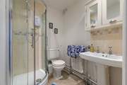 A roomy en suite for the principal bedroom awaits.