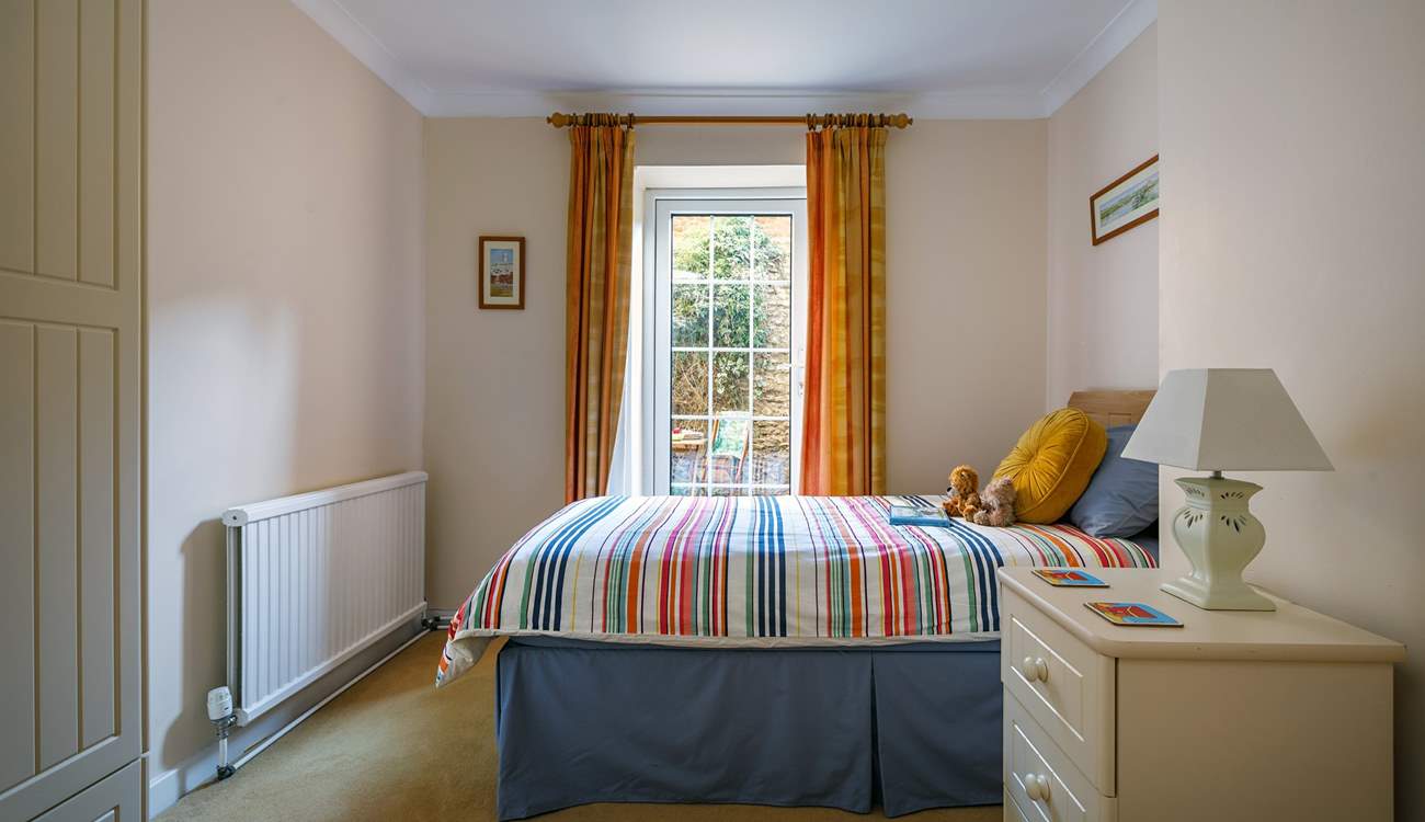 The light floods into the twin bedroom and opens onto the terrace, great for couples.