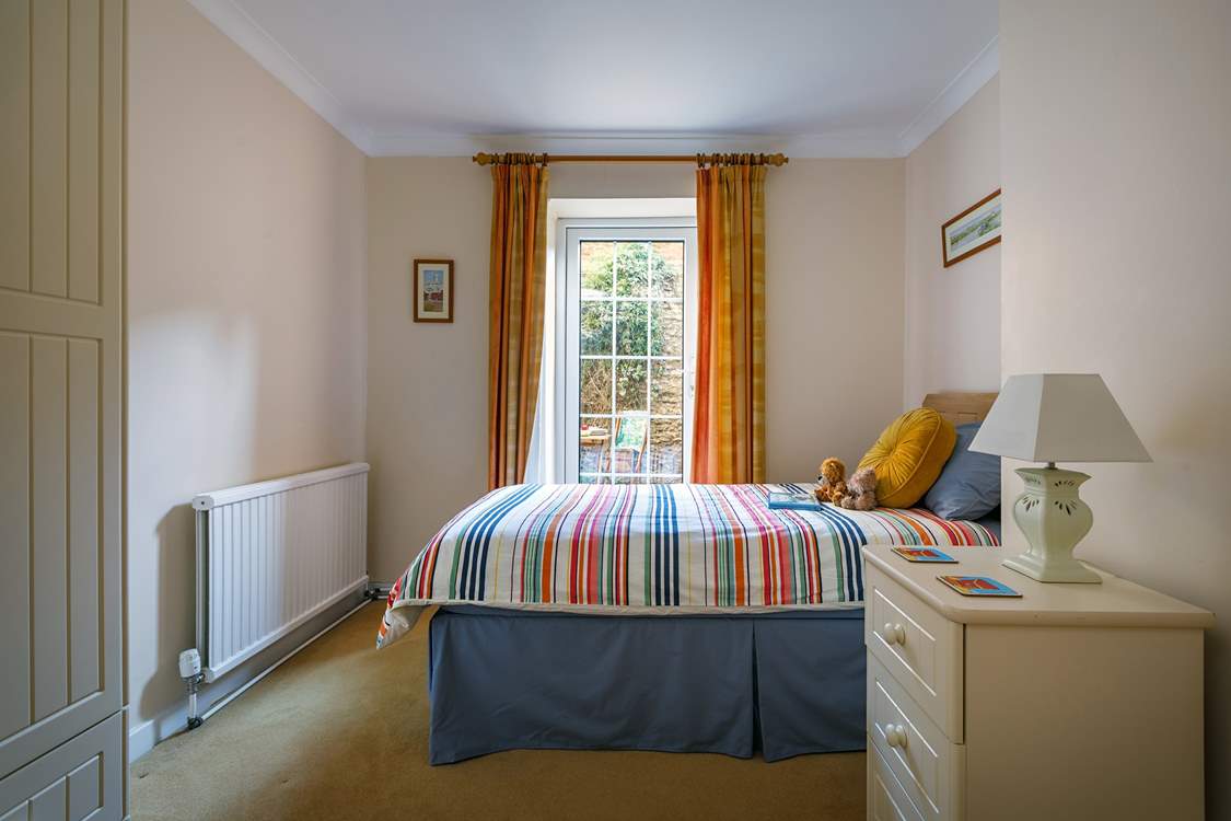 The light floods into the twin bedroom and opens onto the terrace, great for couples.