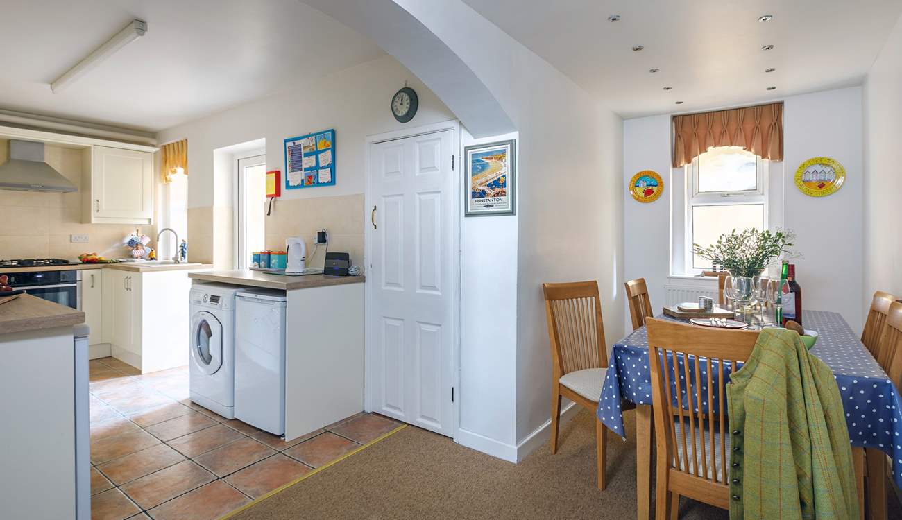 The light floods into the well-equipped kitchen.