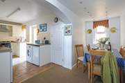 The light floods into the well-equipped kitchen.