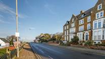 Far left of the row is The Garden Flat on the lower ground floor, image shown looking towards Old Hunstanton.