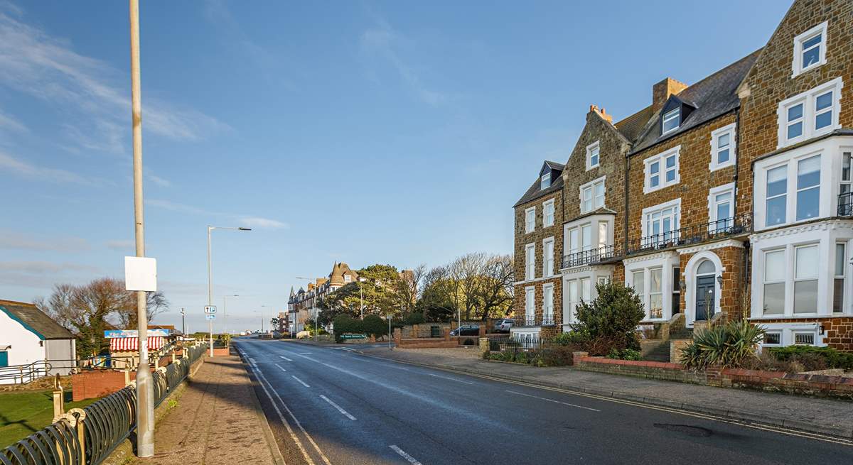 Far left of the row is The Garden Flat on the lower ground floor, image shown looking towards Old Hunstanton.