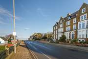 Far left of the row is The Garden Flat on the lower ground floor, image shown looking towards Old Hunstanton.