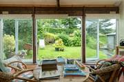Enjoy the pretty garden throughout the year from the sun room.