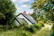 Explore the three acres of gardens or the leafy lanes near the cottage.