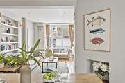 The open plan sitting/dining-room creates a warm welcome.