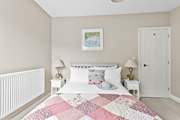 A king-size bed awaits in bedroom 1.