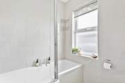 The family bathroom also has a shower above the bath.