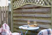There is a small sheltered area at the back for al fresco dining (the owner is also developing another outside area at the back. Set higher up it will enjoy views of the water - to be completed later in 2025).