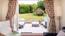 Relax and enjoy the gorgeous garden views from the sitting-room. 