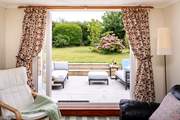 Take in the garden views from the sitting-room.