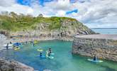 Spend time on the water and try stand up paddle boarding at Stackpole Quay. The Stackpole Inn serves the tastiest Sunday lunch.   - Thumbnail Image