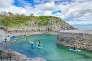 Spend time on the water and try stand up paddle boarding at Stackpole Quay. The Stackpole Inn serves the tastiest Sunday lunch.