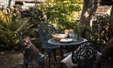 Take advantage of the good weather in this lovely courtyard garden. - Thumbnail Image