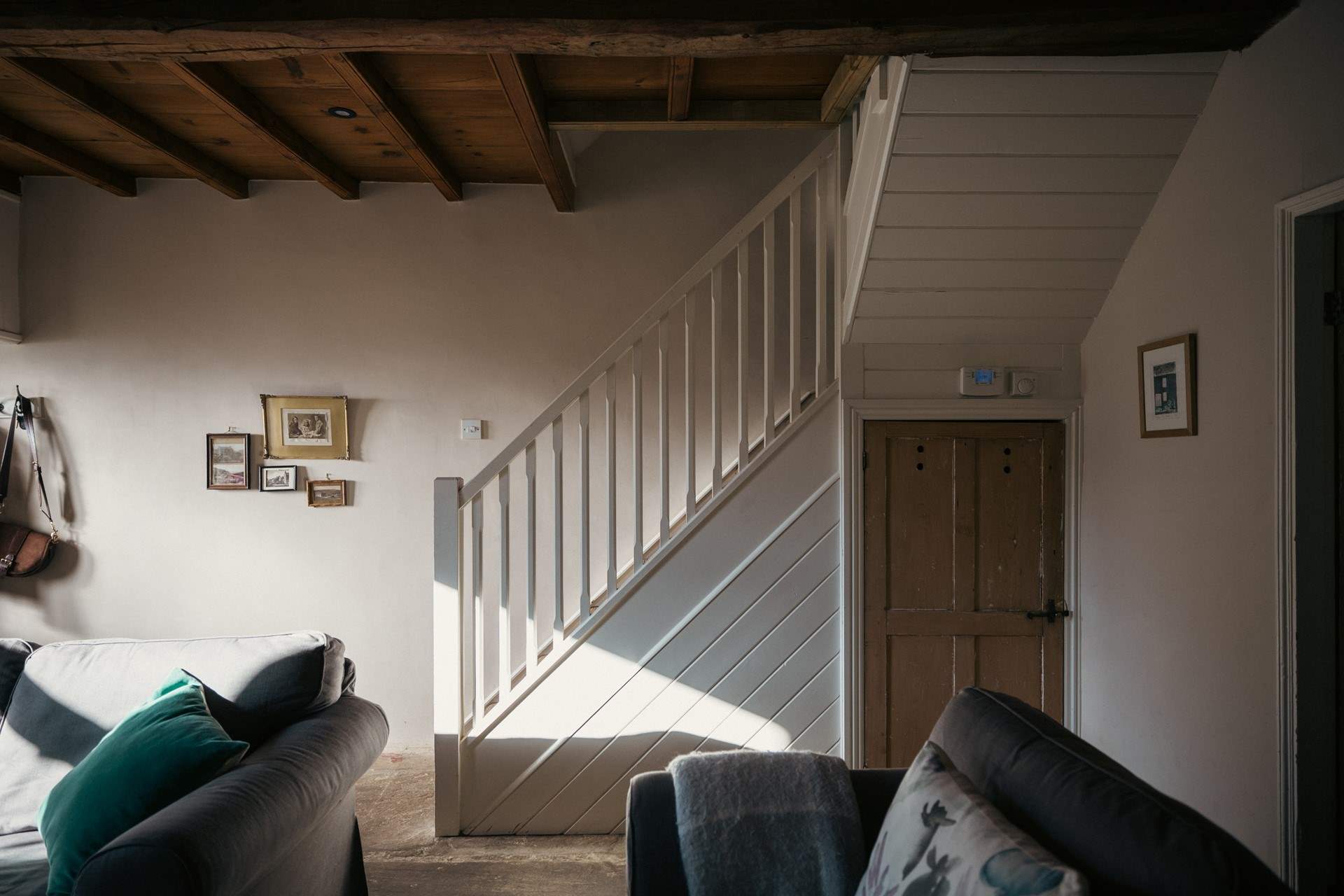 The stairs from the sitting-room lead up to the bedrooms and bathroom.