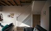 The stairs from the sitting-room lead up to the bedrooms and bathroom. - Thumbnail Image