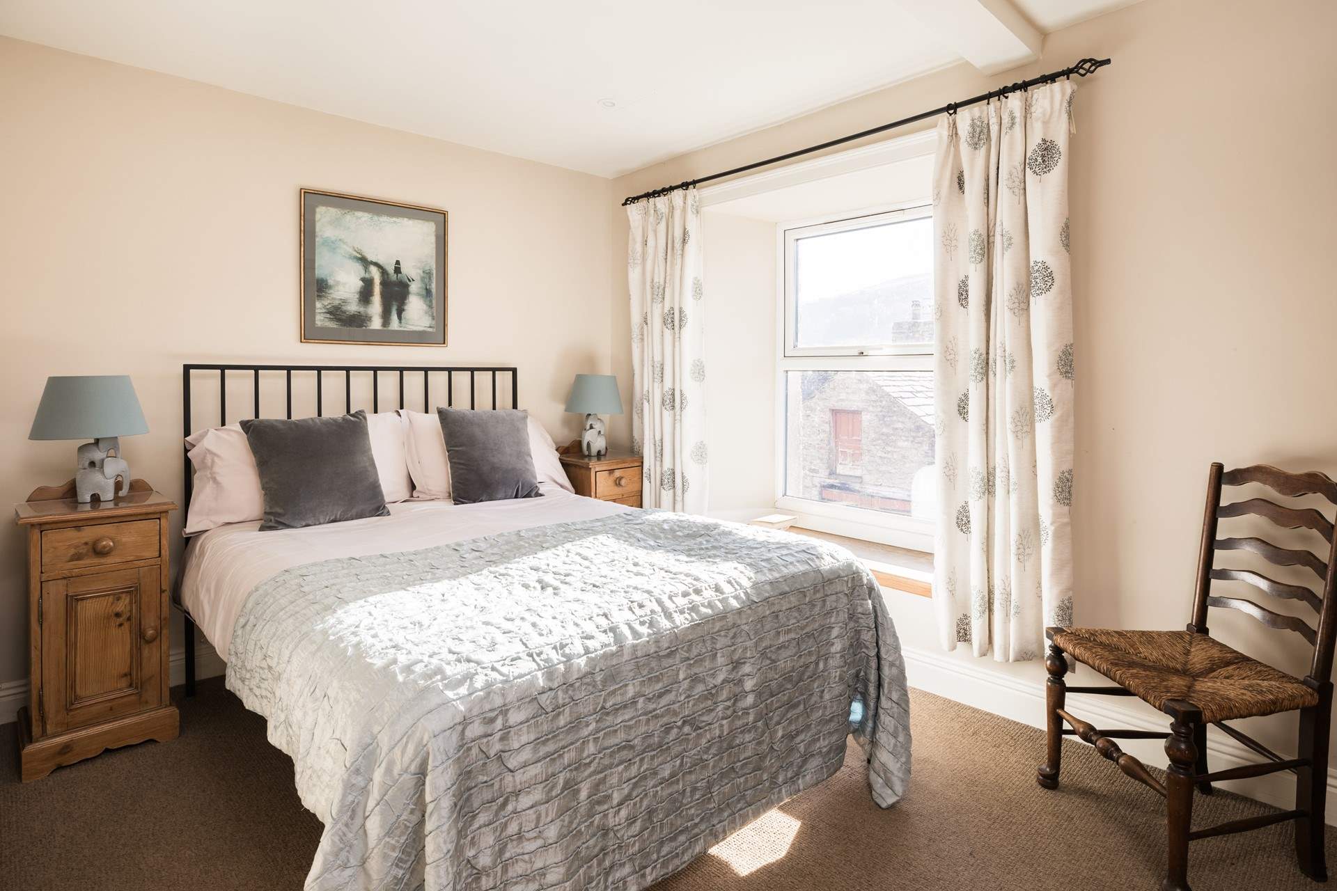 Retire to this beautiful bright country-style bedroom.