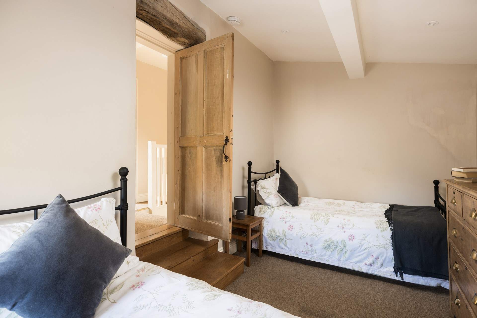 Three steps down to the lovely twin bedroom.