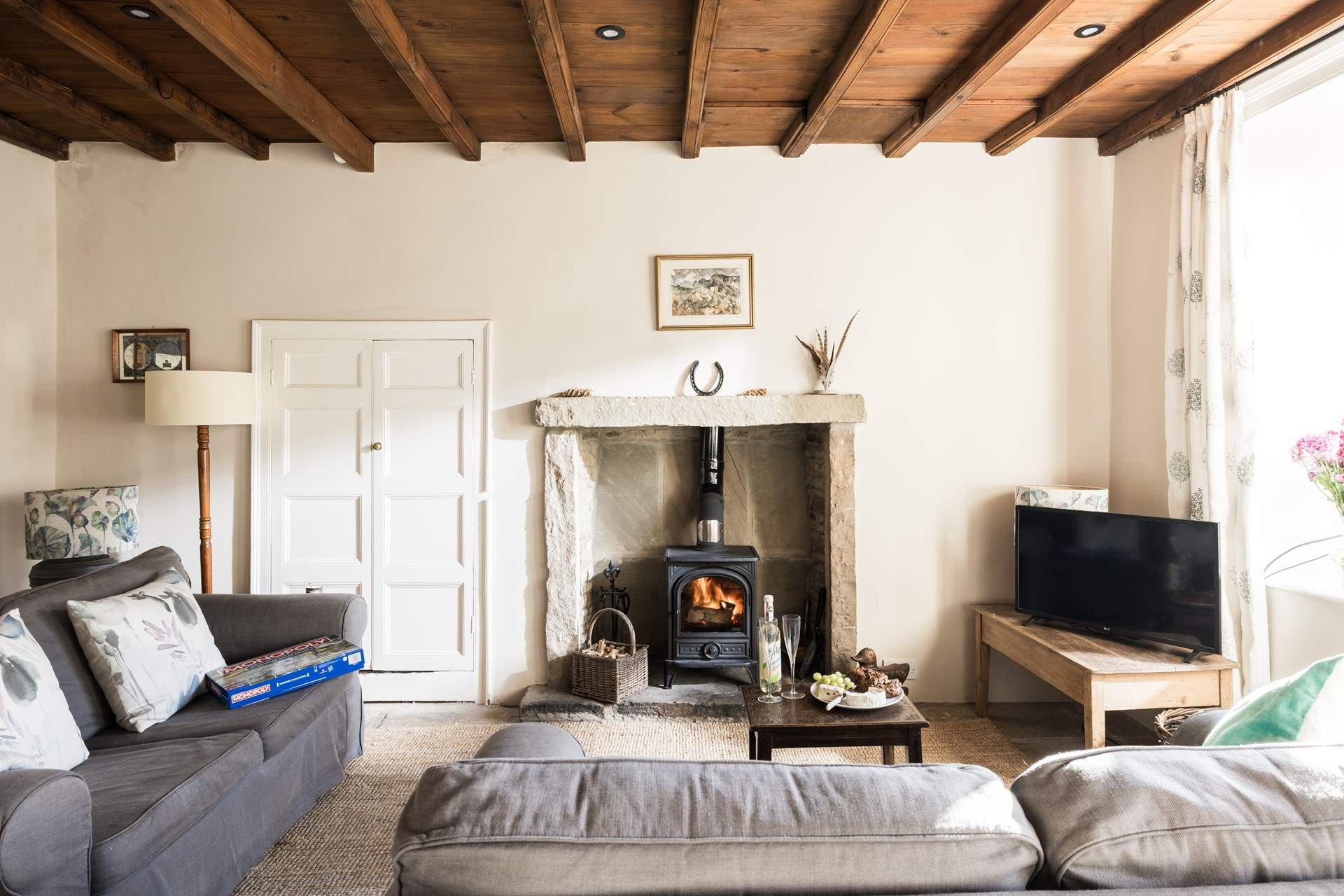 The comfortable sitting-room with stone floor and beamed ceiling is a great place to relax at the end of a busy day on the hills.