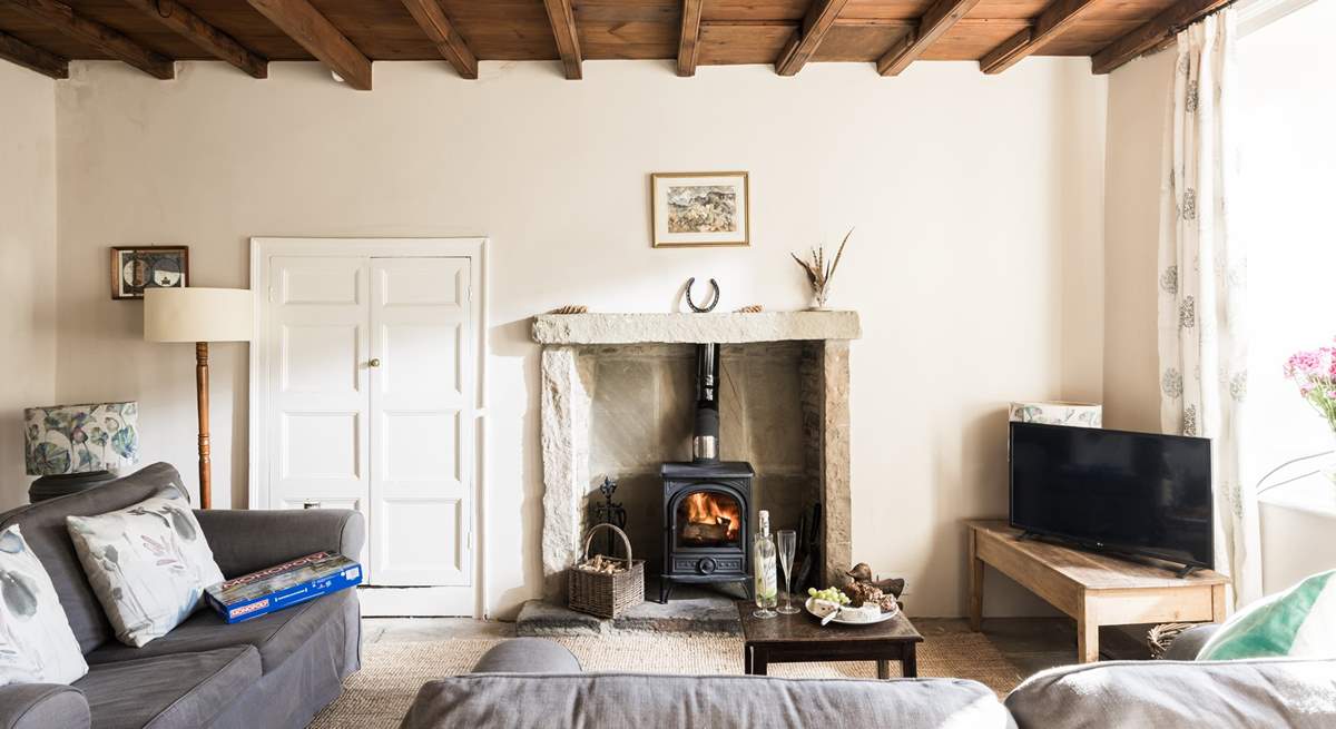 The comfortable sitting-room with stone floor and beamed ceiling is a great place to relax at the end of a busy day on the hills.