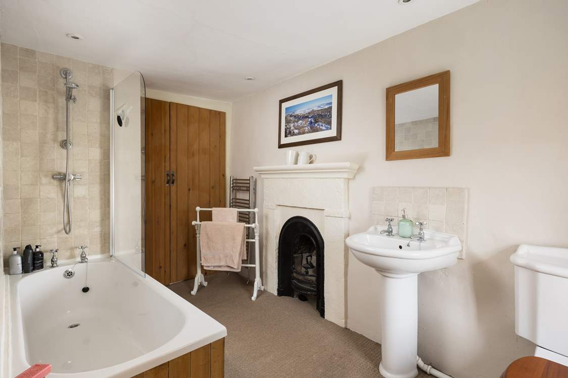 The original fireplace gives a nod to how previous families lived in this lovely old farmhouse.