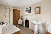 The original fireplace gives a nod to how previous families lived in this lovely old farmhouse.