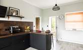 Walk through the door into the stylish kitchen. - Thumbnail Image