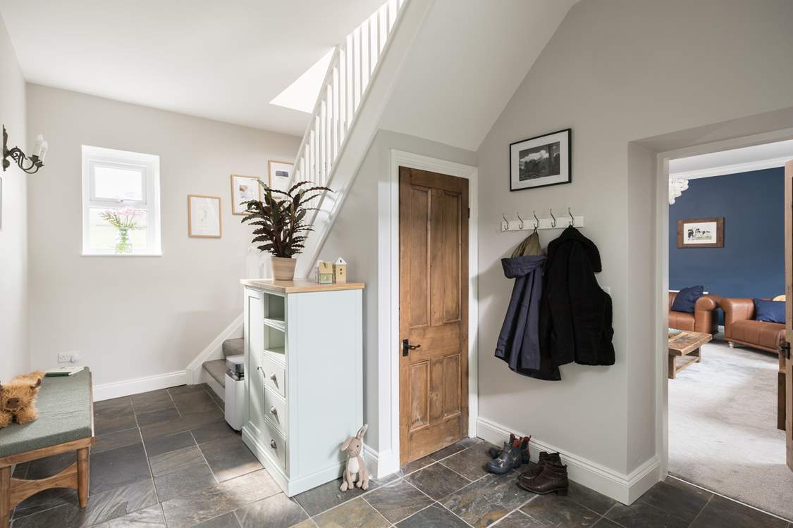 Take the stairs to your choice of elegant bedrooms.