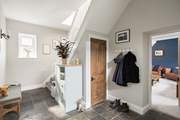Take the stairs to your choice of elegant bedrooms.