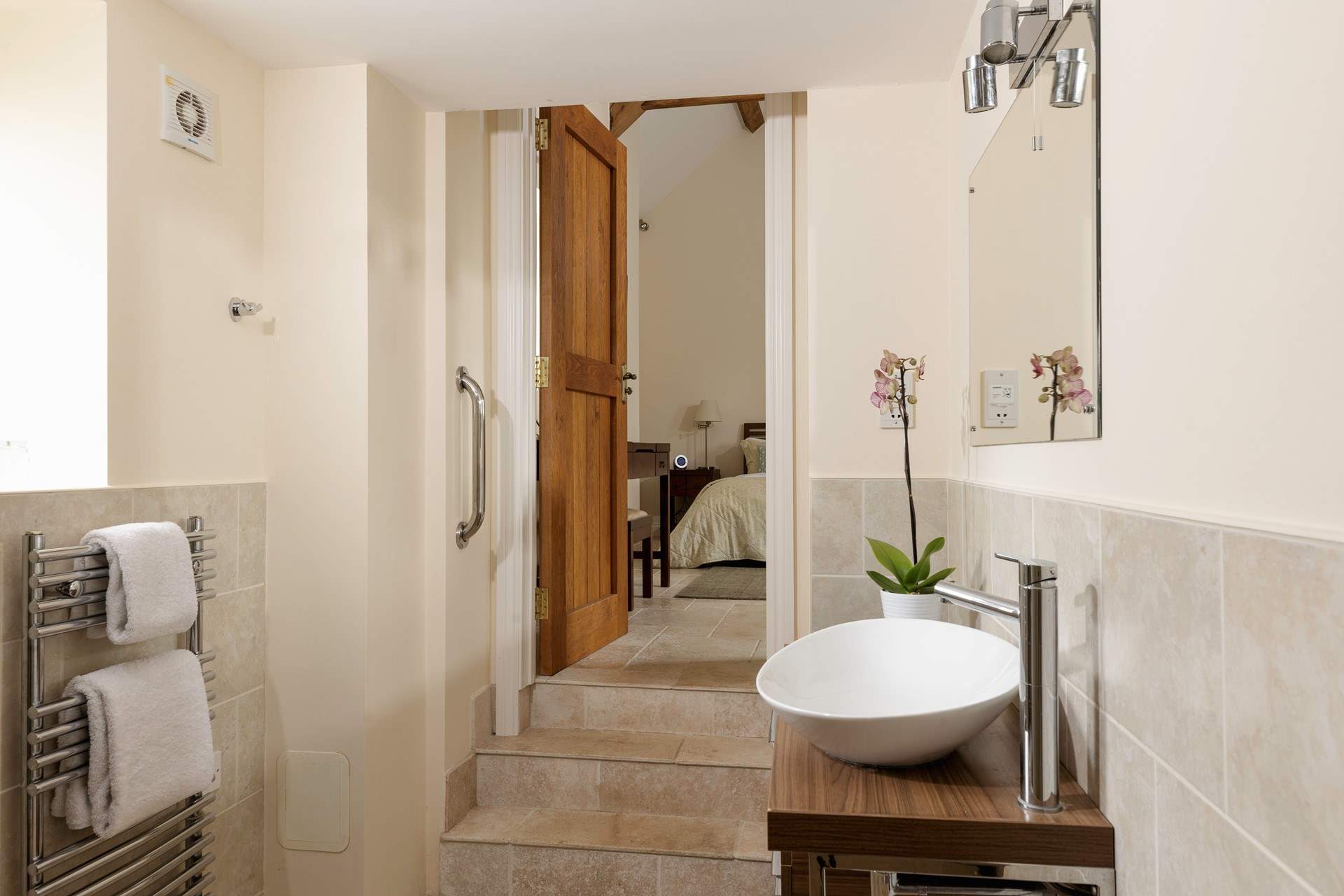 Peeking through from the en suite wet-room to the bedroom.