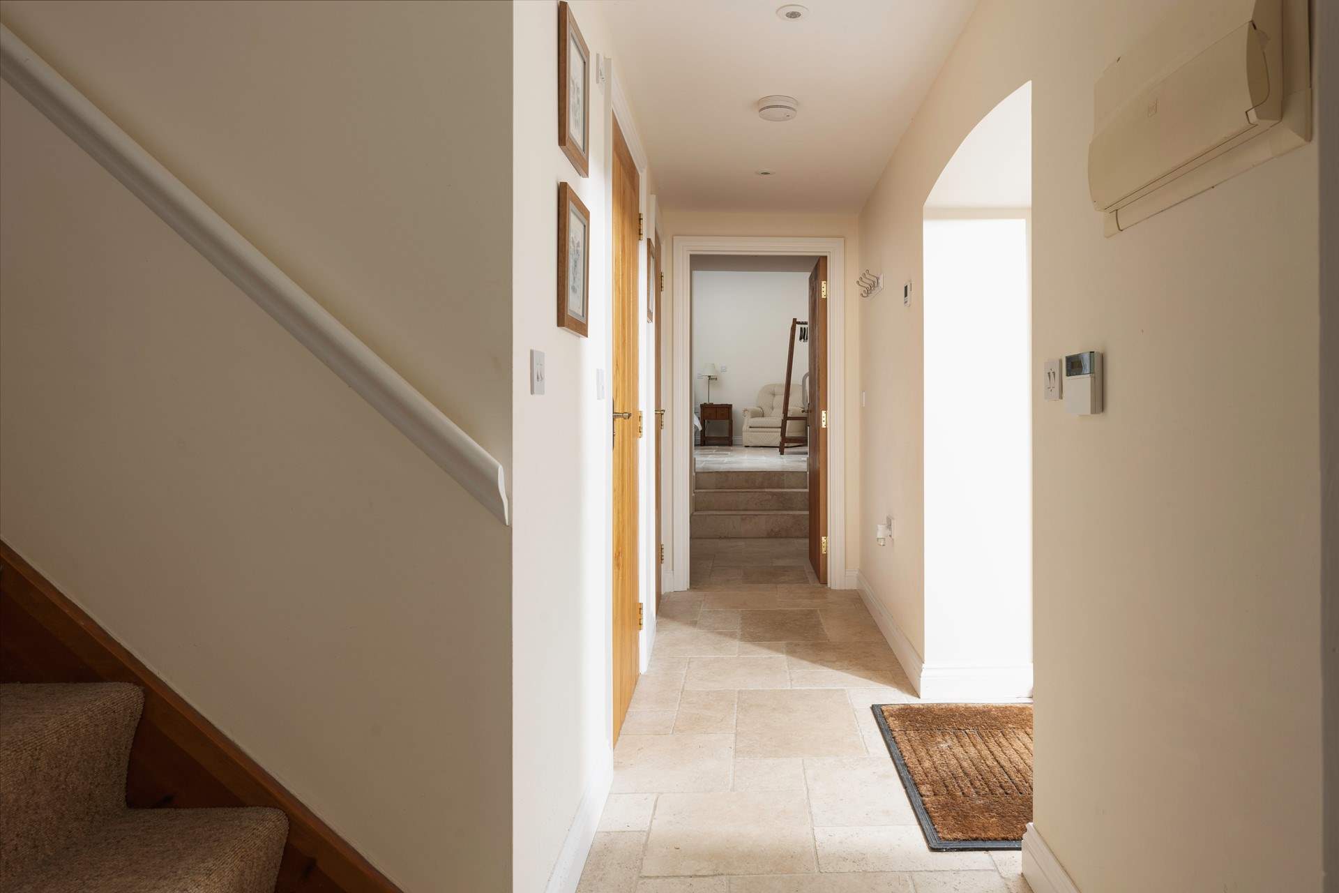 Step through into the hallway.