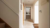 Step through into the hallway.