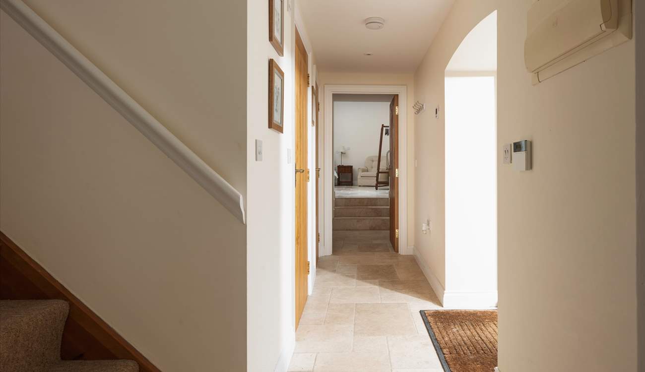 Step through into the hallway.