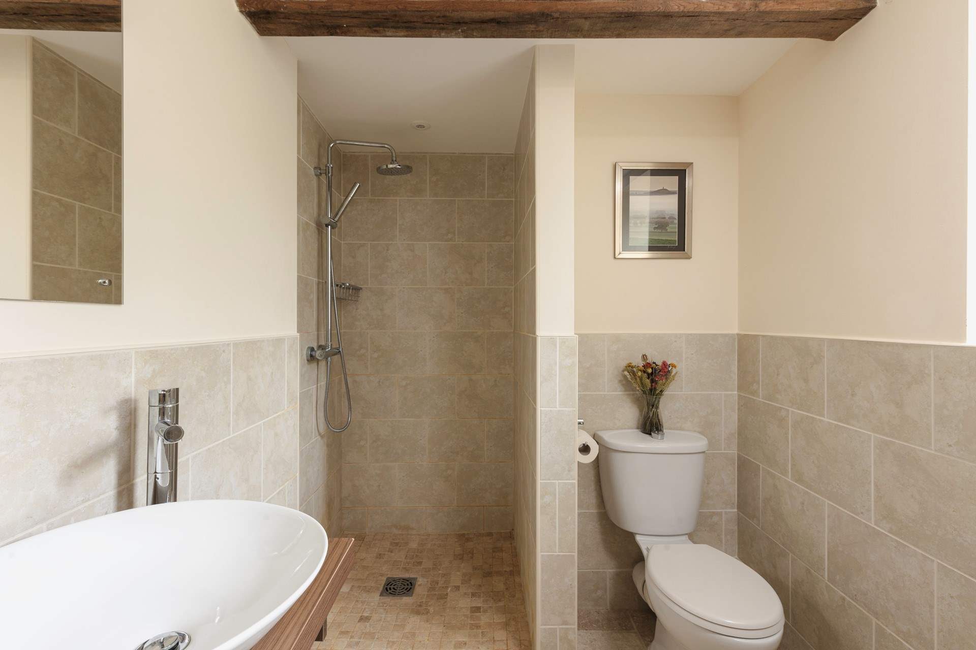 The en suite wet-room is modern and bright.
