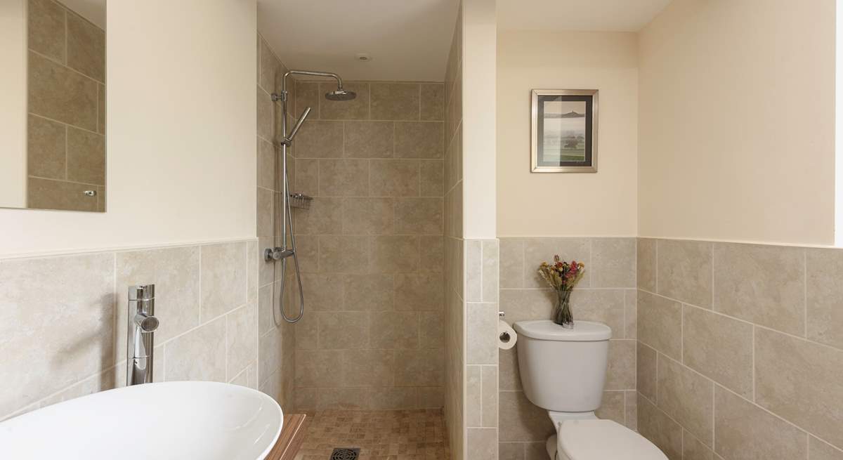 The en suite wet-room is modern and bright.