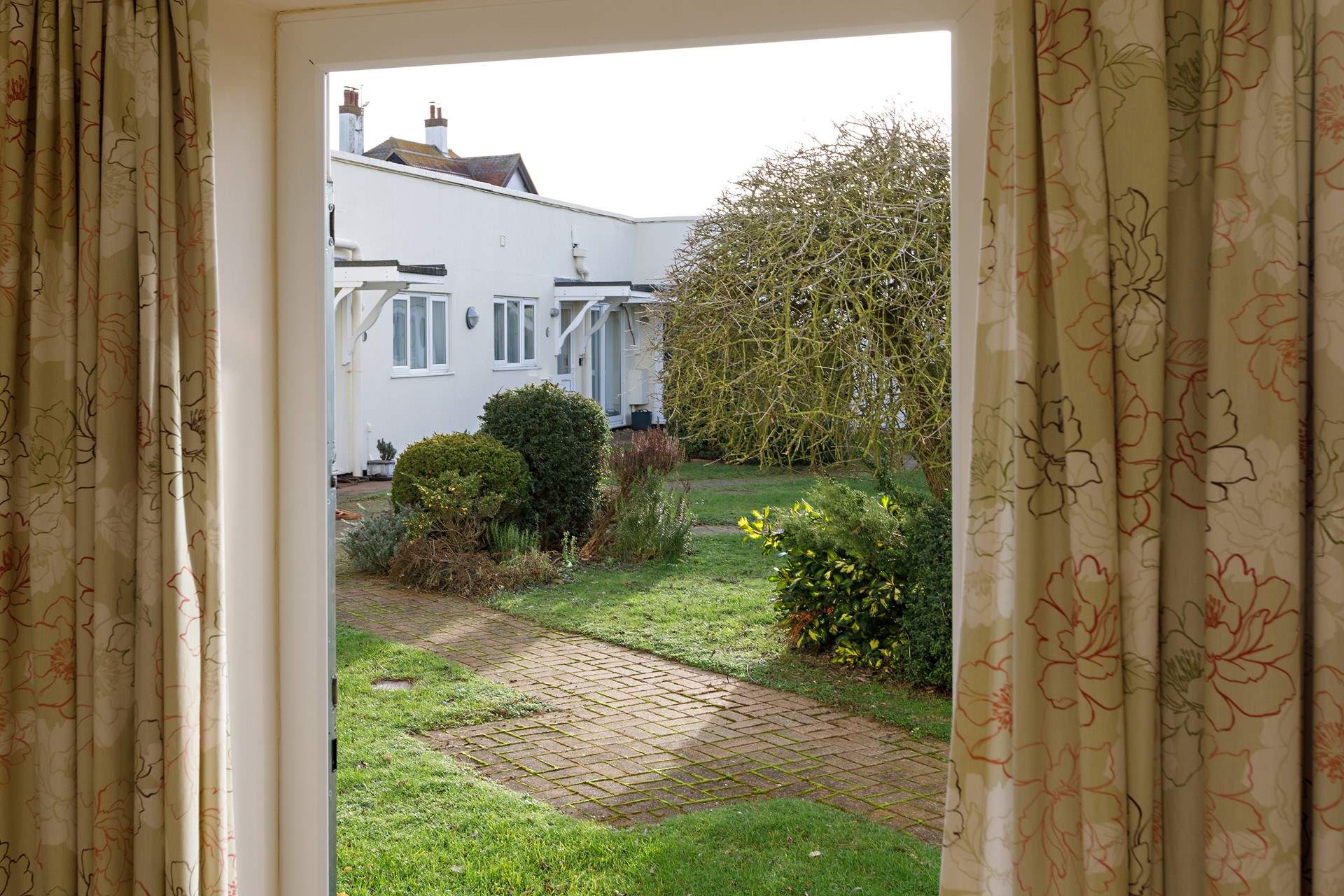 A door from the main bedroom opens out to the communal garden.