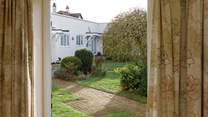 A door from the main bedroom opens out to the communal garden.