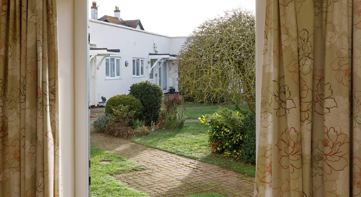 A door from the main bedroom opens out to the communal garden.