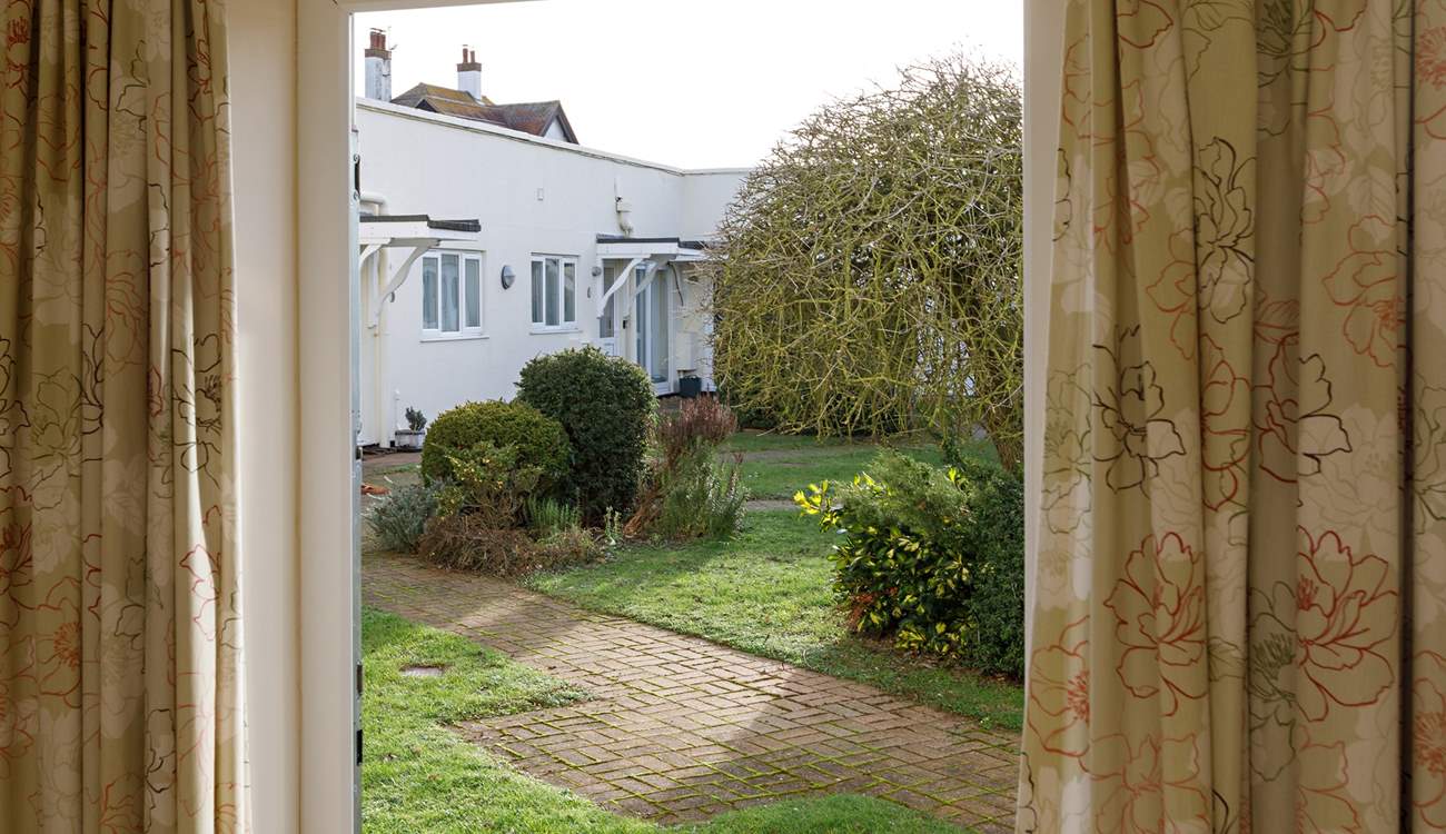 A door from the main bedroom opens out to the communal garden.