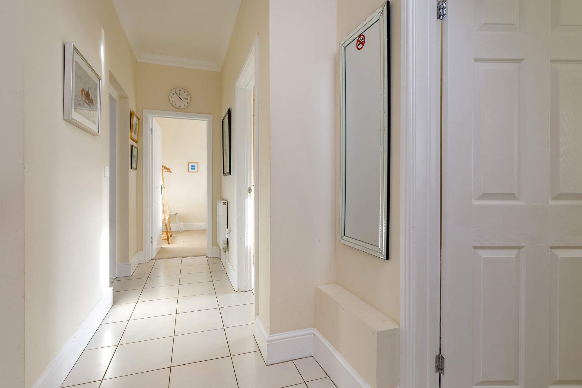 The light-filled  hallway leads to the bedrooms and bathroom.