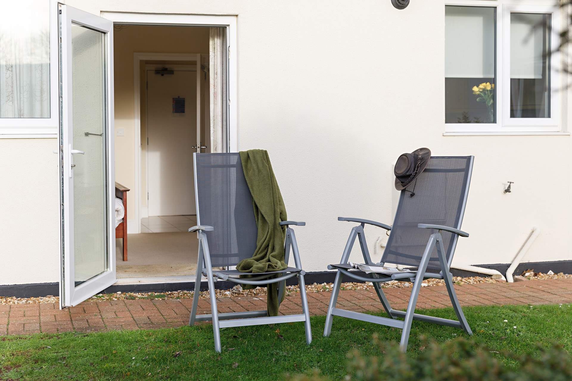 Enjoy a glass of vino on the lawns outside your private door at Sandy Shores.