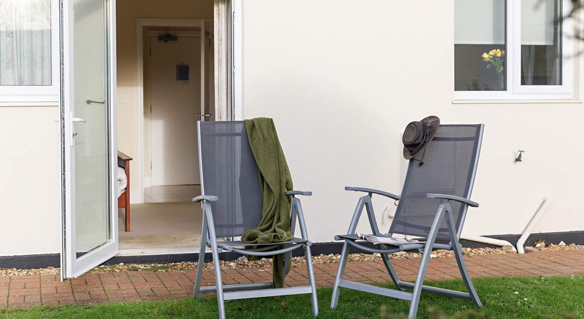 Enjoy a glass of Vino  on the lawns outside your private door from Sandy Shores.