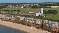 The iconic red and white striped cliffs of Hunstanton and its light house.