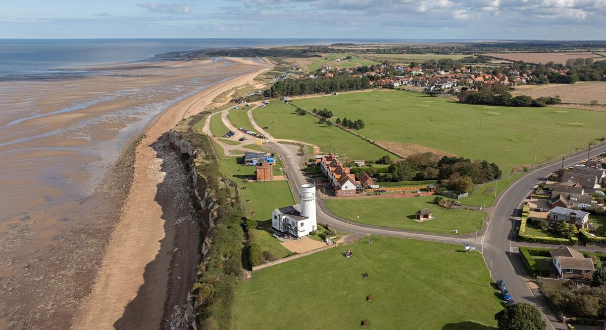 An aerial view of Hunstanton lighthouse and the changing tides of towards Old Hunstanton, minutes walk from Sandy Shores.