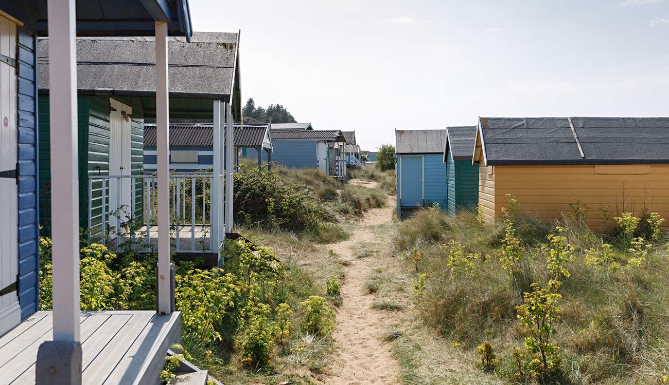 The gorgeous pastel shades of beach huts are moment from the apartment  greeted by the soft sandy beaches and shoreline.